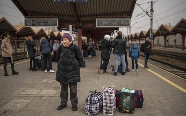 A Ukrainian evacuee waits to board a train en route to Warsaw at the rail station in Przemysl, near the Polish-Ukrainian border, on March 29, 2022.  (Angelos Tzortzinis / AFP)
