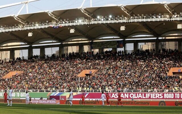 Supporters watch the 2022 Qatar World Cup Asian Qualifiers soccer match between Iran and Lebanon, at the Imam Reza Stadium in the city of Mashhad, on March 29, 2022. (Farshad Abbasi/AFP)