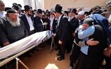 Mourners attend the funeral of Avishai Yehezkel, one of the five people killed in a terror attack in Bnei Brak, on March 30, 2022 (Menahem KAHANA / AFP)