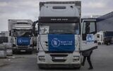Trucks with UN humanitarian assistance are seen departing from Poland to Ukraine, March 10, 2022. (Wojtek Radwanski/European Union/AFP)