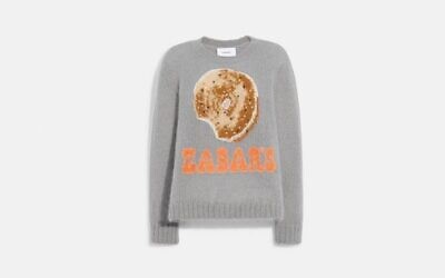 The gray sweater pays tribute to the Upper West Side food emporium and retails for $495. (Coach)