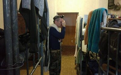 Tzvi Arieli, seen here praying in a Ukrainian army barracks in 2017, is a Ukrainian immigrant from Israel who is fighting in its army. (Courtesy Arieli/ via JTA)