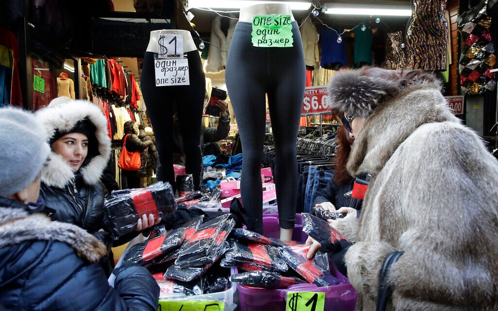 In this December 16, 2016 photo, women choose stockings for sale in a Brighton Beach clothing store in the Brooklyn borough of New York. (AP Photo/Mark Lennihan)