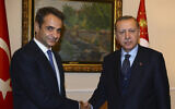 Turkey's President Recep Tayyip Erdogan, right, on a two-day official visit to Greece, meets Prime Minister Kyriakos Mitsotakis, left, at the time leader of the main opposition New Democracy party in Athens, December 7, 2017. (Kayhan Ozer/Pool via AP)