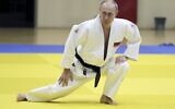 In this pool photo taken on Thursday, February 14, 2019, Russian President Vladimir Putin attends a training session with the Russian national judo team at the Yug-Sport Training Center in Sochi, Russia. (Mikhail Klimentyev/Sputnik, Kremlin Pool Photo via AP)