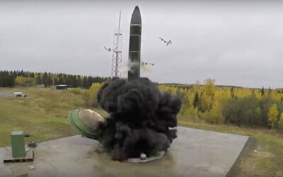 An intercontinental ballistic missile lifts off from a silo somewhere in Russia, in undated footage. (Russian Defense Ministry Press Service, via AP)