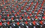In this September 21, 2016, file photo, Iran’s Revolutionary Guard troops march in a military parade in Tehran, Iran. ​(AP Photo/Ebrahim Noroozi, File)