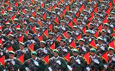 In this September 21, 2016, file photo, Iran’s Revolutionary Guard troops march in a military parade in Tehran, Iran. ​(AP Photo/Ebrahim Noroozi, File)