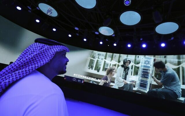 A Journalist watches a show of the Israeli pavilion during a media tour at the Dubai Expo in Dubai, United Arab Emirates, Sept. 27, 2021 (AP Photo/Kamran Jebreili) A Journalist watches a show of the Israeli pavilion during a media tour at the Dubai Expo in Dubai, United Arab Emirates, Sept. 27, 2021 (AP Photo/Kamran Jebreili)