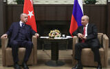 Russian President Vladimir Putin, right, and Turkish President Recep Tayyip Erdogan during their meeting in the Bocharov Ruchei residence in the Black Sea resort of Sochi, Russia, Sept. 29, 2021. (Vladimir Smirnov/Sputnik, Kremlin/Pool Photo via AP)