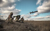 In this image released by Ukrainian Defense Ministry Press Service, Ukrainian soldiers use a launcher with US Javelin missiles during military exercises in Donetsk region, Ukraine, December 23, 2021. (Ukrainian Defense Ministry Press Service via AP)