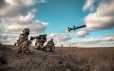 In this image released by Ukrainian Defense Ministry Press Service, Ukrainian soldiers use a launcher with US Javelin missiles during military exercises in Donetsk region, Ukraine, December 23, 2021. (Ukrainian Defense Ministry Press Service via AP)