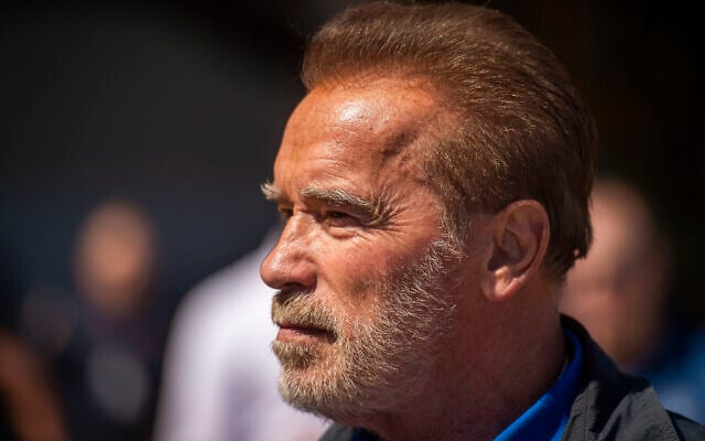Former California Gov. Arnold Schwarzenegger looks at a Super Huey, a helicopter used for dropping water at fires, during a tour at McClellan Air Force Base in Sacramento, Calif., on Aug. 1, 2019. (Daniel Kim/The Sacramento Bee via AP) Former California Gov. Arnold Schwarzenegger looks at a Super Huey, a helicopter used for dropping water at fires, during a tour at McClellan Air Force Base in Sacramento, Calif., on Aug. 1, 2019. (Daniel Kim/The Sacramento Bee via AP)