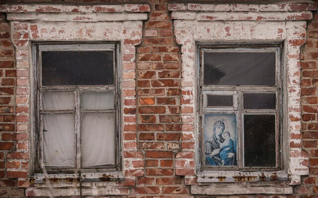An icon is placed in the window of an abandoned house near the frontline, outside Avdiivka, Donetsk region, eastern Ukraine, Feb. 9, 2022 (AP Photo/Vadim Ghirda)
