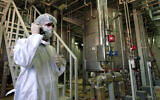 A person involved with security at the Uranium Conversion Facility just outside the city of Isfahan, Iran, on March 30, 2005. (AP Photo/Vahid Salemi, File)