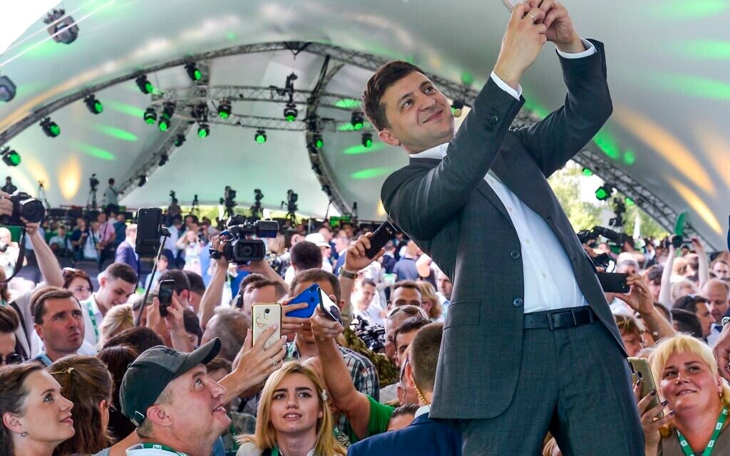 Illustrative: Ukrainian President Volodymyr Zelensky takes a selfie at the first congress of his party called Servant of the People in the city Botanical Garden, Kyiv, Ukraine, June 9, 2019. (AP Photo/Zoya Shu) Illustrative: Ukrainian President Volodymyr Zelensky takes a selfie at the first congress of his party called Servant of the People in the city Botanical Garden, Kyiv, Ukraine, June 9, 2019. (AP Photo/Zoya Shu)