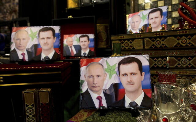 Photos on porcelain decorated with the images of Russian President Vladimir Putin and Syrian President Bashar Assad are displayed in a souvenir shop in Damascus, Syria, on April 18, 2016. Political observers say Russia’s brazen Syria intervention emboldened Putin, giving him a renewed Middle East foothold and helped pave the way for his current attack on Ukraine. (AP Photo/Hassan Ammar, File) Photos on porcelain decorated with the images of Russian President Vladimir Putin and Syrian President Bashar Assad are displayed in a souvenir shop in Damascus, Syria, on April 18, 2016. Political observers say Russia’s brazen Syria intervention emboldened Putin, giving him a renewed Middle East foothold and helped pave the way for his current attack on Ukraine. (AP Photo/Hassan Ammar, File)