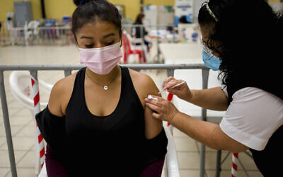 A healthcare worker administers an AstraZeneca booster shot for COVID-19 at a vaccination center in Guatemala City, March 1, 2022. (AP Photo/Moises Castillo) A healthcare worker administers an AstraZeneca booster shot for COVID-19 at a vaccination center in Guatemala City, March 1, 2022. (AP Photo/Moises Castillo)