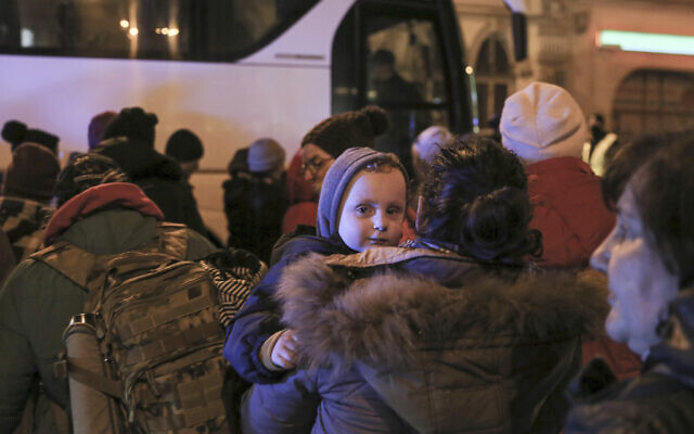 Women and children refugees fleeing the Russian invasion from Ukraine board a bus to Warsaw in Przemysl, Poland, March 1, 2022 (AP Photo/Visar Kryeziu) Women and children refugees fleeing the Russian invasion from Ukraine board a bus to Warsaw in Przemysl, Poland, March 1, 2022 (AP Photo/Visar Kryeziu)
