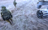 In this image taken from video released by Russian Defense Ministry Press Service on Tuesday, March 1, 2022, Russian soldiers disembark from a Russian military helicopter after landing at an undisclosed location in Ukraine. (Russian Defense Ministry Press Service via AP)
