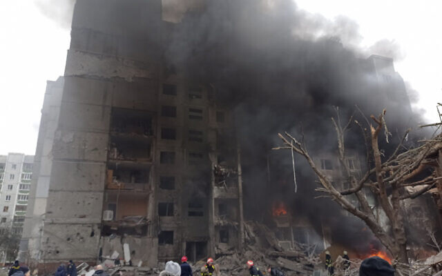 Firefighters work to extinguish a fire at a damaged city center after a Russian air raid in Chernigiv, Ukraine, March 3, 2022. (AP Photo/Dmytro Kumaka) Firefighters work to extinguish a fire at a damaged city center after a Russian air raid in Chernigiv, Ukraine, March 3, 2022. (AP Photo/Dmytro Kumaka)