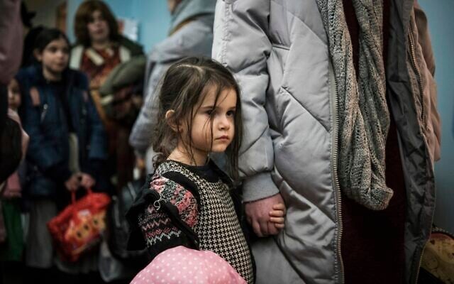Children and their companions from an orphanage in Odesa, Ukraine, wait for room allocation after their arrival at a hotel in Berlin, on Friday, March 4, 2022. More than 100 Jewish refugee children who were evacuated from a foster care home in war-torn Ukraine and made their way across Europe by bus have arrived in Berlin. (AP Photo/Steffi Loos) Children and their companions from an orphanage in Odesa, Ukraine, wait for room allocation after their arrival at a hotel in Berlin, on Friday, March 4, 2022. More than 100 Jewish refugee children who were evacuated from a foster care home in war-torn Ukraine and made their way across Europe by bus have arrived in Berlin. (AP Photo/Steffi Loos)