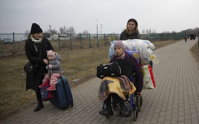 Refugees, mostly women with children, arrive at the border crossing in Medyka, Poland, March 5, 2022, after fleeing Russian invasion in Ukraine. (AP Photo/Visar Kryeziu) Refugees, mostly women with children, arrive at the border crossing in Medyka, Poland, March 5, 2022, after fleeing Russian invasion in Ukraine. (AP Photo/Visar Kryeziu)