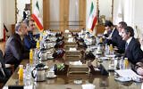 International Atomic Energy Organization, IAEA, Director General Rafael Mariano Grossi, right, speaks with with Iran's Foreign Minister Hossein Amirabdollahian, left, during their meeting in Tehran, March 5, 2022. (AP Photo)