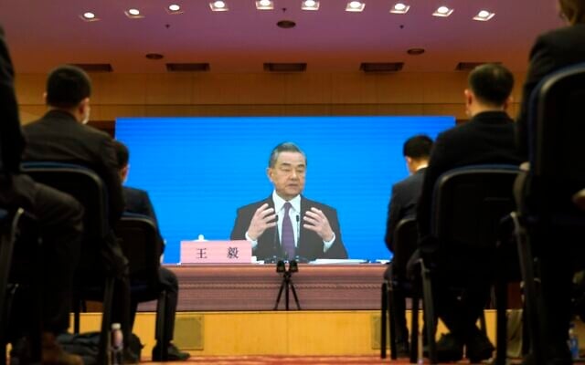 Chinese Foreign Minister Wang Yi speaks during a remote video press conference held on the sidelines of the annual meeting of China's National People's Congress (NPC) in Beijing, on March 7, 2022 (AP Photo/ Sam McNeil) Chinese Foreign Minister Wang Yi speaks during a remote video press conference held on the sidelines of the annual meeting of China's National People's Congress (NPC) in Beijing, on March 7, 2022 (AP Photo/ Sam McNeil)