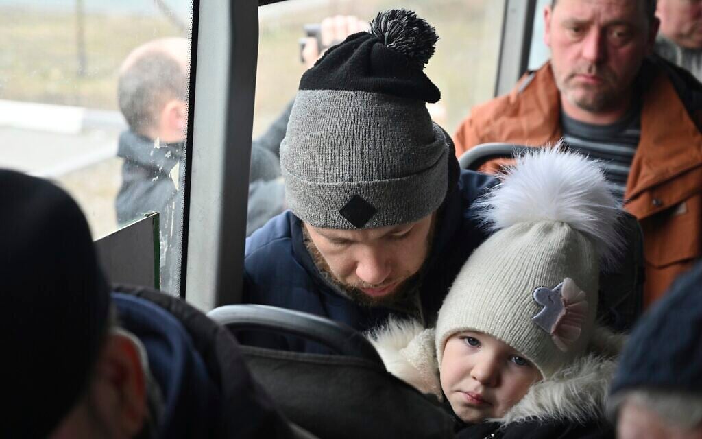Refugees fleeing fleeing the military operation zone from the Mariupol area of Ukraine sit in a bus as they arrive at the border crossing in Veselo-Voznesenka, Russia, March 7, 2022. (AP Photo) Refugees fleeing fleeing the military operation zone from the Mariupol area of Ukraine sit in a bus as they arrive at the border crossing in Veselo-Voznesenka, Russia, March 7, 2022. (AP Photo)