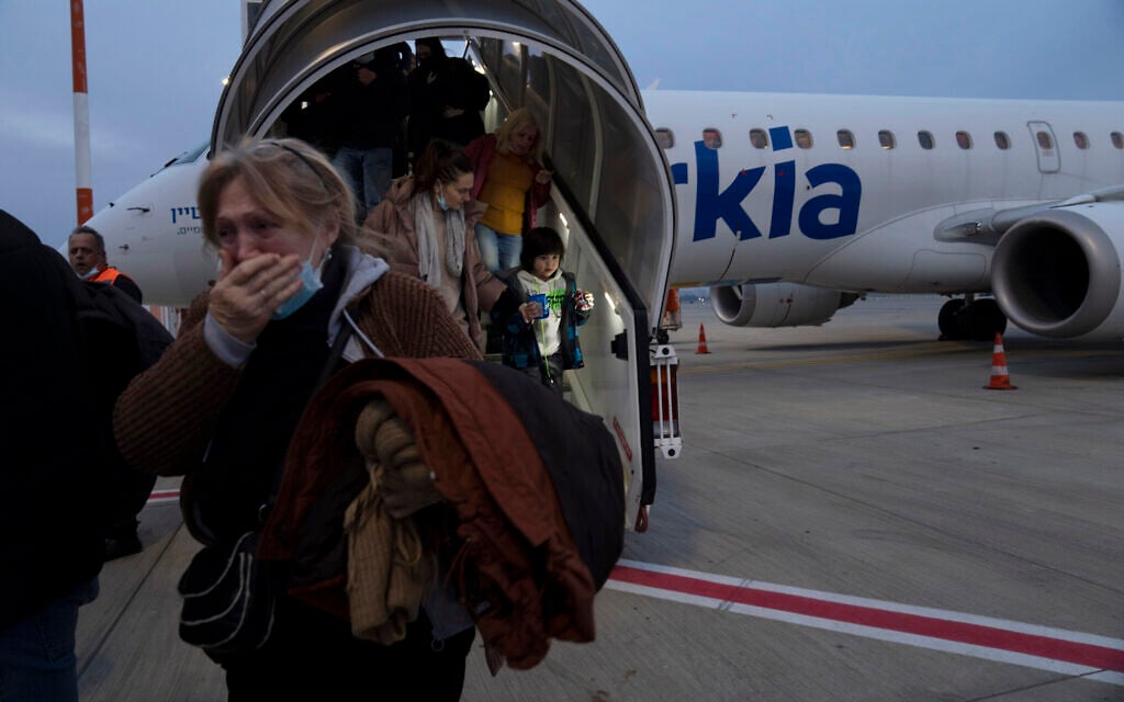 Ukrainians disembark from a special flight to Israel from Romania upon landing at Ben Gurion Airport, March 8, 2022  (AP Photo/Maya Alleruzzo)