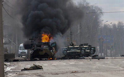 A Russian armored personnel carrier burns amid damaged and abandoned light utility vehicles after fighting in Kharkiv, Ukraine, Feb. 27, 2022. (AP Photo/Marienko Andrew, File) A Russian armored personnel carrier burns amid damaged and abandoned light utility vehicles after fighting in Kharkiv, Ukraine, Feb. 27, 2022. (AP Photo/Marienko Andrew, File)