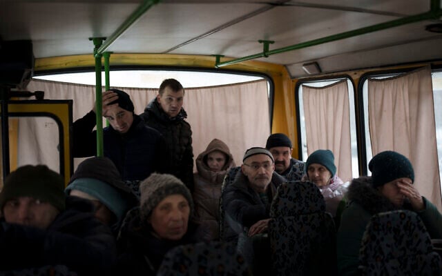 Ukrainians enter a bus as they are evacuated from Irpin, on the outskirts of Kyiv, Ukraine,March 9, 2022. (AP Photo/Felipe Dana) Ukrainians enter a bus as they are evacuated from Irpin, on the outskirts of Kyiv, Ukraine,March 9, 2022. (AP Photo/Felipe Dana)