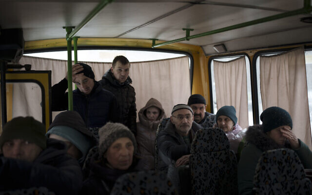 Ukrainians enter a bus as they are evacuated from Irpin, on the outskirts of Kyiv, Ukraine, Wednesday, March 9, 2022. (AP Photo/Felipe Dana) Ukrainians enter a bus as they are evacuated from Irpin, on the outskirts of Kyiv, Ukraine, Wednesday, March 9, 2022. (AP Photo/Felipe Dana)
