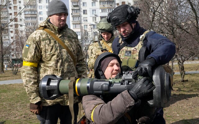 Ukrainian Territorial Defence Forces members train to use an NLAW anti-tank weapon in Kyiv outskirts, Ukraine, on Wednesday, March 9, 2022. (AP Photo/Efrem Lukatsky) Ukrainian Territorial Defence Forces members train to use an NLAW anti-tank weapon in Kyiv outskirts, Ukraine, on Wednesday, March 9, 2022. (AP Photo/Efrem Lukatsky)