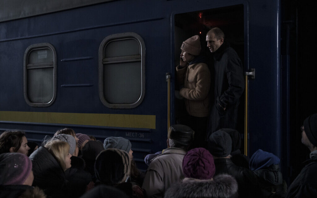 People attempt to board a train leaving the Kyiv station, in Kyiv, Ukraine, March 9, 2022. (AP Photo/Felipe Dana)