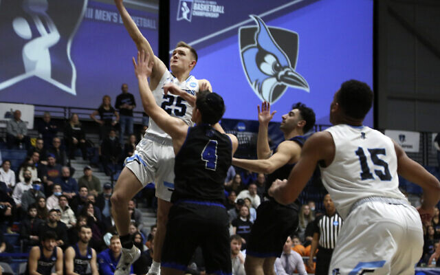 Johns Hopkins University's Lincoln Yeutter (25) reaches for a layup in the first round of the NCAA's Division III basketball tournament against Yeshiva University, in Galloway Township, New Jersey, March 4, 2022. (AP Photo/Jessie Wardarski)