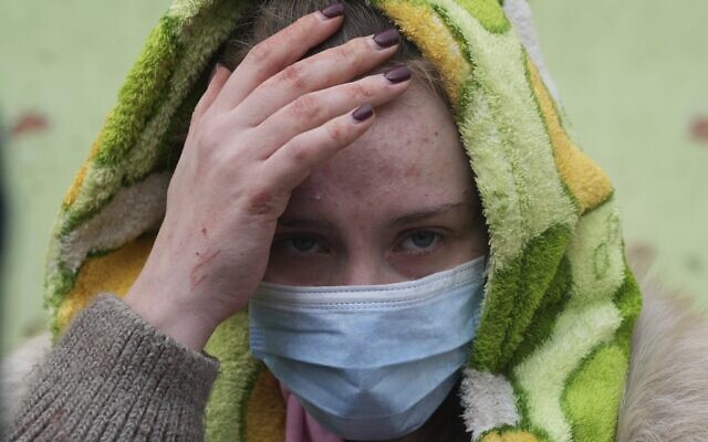 A woman walks outside a maternity hospital that was shelled by Russia in Mariupol, Ukraine, Wednesday, March 9, 2022. (AP Photo/Evgeniy Maloletka) A woman walks outside a maternity hospital that was shelled by Russia in Mariupol, Ukraine, Wednesday, March 9, 2022. (AP Photo/Evgeniy Maloletka)