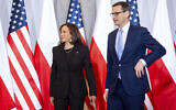 Poland's Prime Minister Mateusz Morawiecki, right, greets US Vice President Kamala Harris as she arrives for a meeting, in Warsaw, Poland, March 10, 2022. (Saul Loeb/Pool Photo via AP)