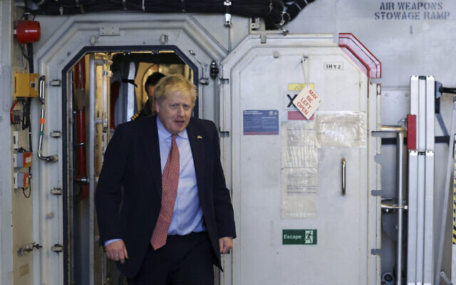 Britain's Prime Minister Boris Johnson walks throuhg HMS Dauntless, a Type 45 air-defence destroyer of the Royal Navy that has undergone a refit, as he visits Cammell Laird shipyard in Birkenhead, England, on March 10, 2022. (Phil Noble/Pool Photo via AP) Britain's Prime Minister Boris Johnson walks throuhg HMS Dauntless, a Type 45 air-defence destroyer of the Royal Navy that has undergone a refit, as he visits Cammell Laird shipyard in Birkenhead, England, on March 10, 2022. (Phil Noble/Pool Photo via AP)
