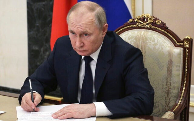 Russian President Vladimir Putin chairs a meeting with members of the government via teleconference in Moscow, March 10, 2022. (Mikhail Klimentyev, Sputnik, Kremlin Pool Photo via AP, File) Russian President Vladimir Putin chairs a meeting with members of the government via teleconference in Moscow, March 10, 2022. (Mikhail Klimentyev, Sputnik, Kremlin Pool Photo via AP, File)