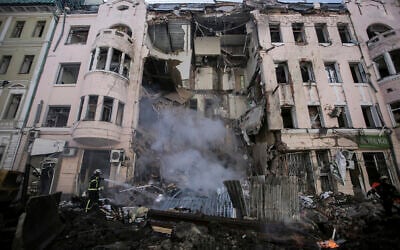 Firefighters extinguish an apartment house after a Russian rocket attack in Kharkiv, Ukraine's second-largest city, Ukraine, March 14, 2022. (AP Photo/Pavel Dorogoy) Firefighters extinguish an apartment house after a Russian rocket attack in Kharkiv, Ukraine's second-largest city, Ukraine, March 14, 2022. (AP Photo/Pavel Dorogoy)