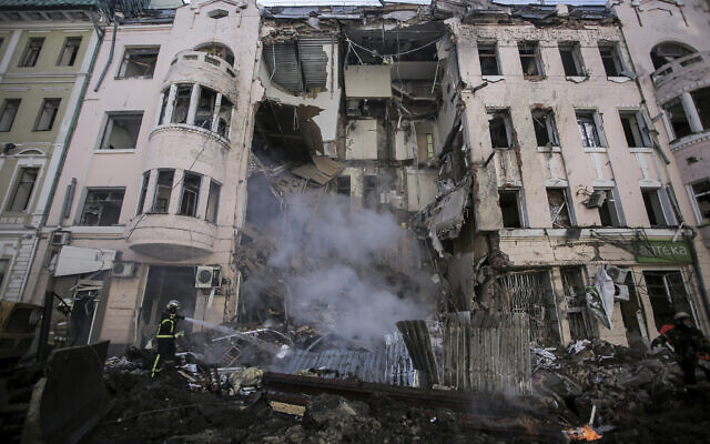 Firefighters extinguish an apartment house after a Russian rocket attack in Kharkiv, Ukraine's second-largest city, Ukraine, March 14, 2022. (AP Photo/Pavel Dorogoy) Firefighters extinguish an apartment house after a Russian rocket attack in Kharkiv, Ukraine's second-largest city, Ukraine, March 14, 2022. (AP Photo/Pavel Dorogoy)