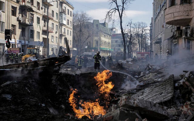 Firefighters extinguish an apartment house after a Russian rocket attack in Kharkiv, Ukraine's second-largest city, Ukraine, Monday, March 14, 2022. (AP/Pavel Dorogoy) Firefighters extinguish an apartment house after a Russian rocket attack in Kharkiv, Ukraine's second-largest city, Ukraine, Monday, March 14, 2022. (AP/Pavel Dorogoy)