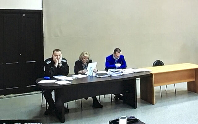 In this image provided by the Russian Federal Penitentiary Service, Russian opposition leader Alexei Navalny, left, is seen via a video link, sitting next to his layers during a court session in Pokrov, Vladimir region, about 100 kilometers (62 miles) east of Moscow, Russia, March 15, 2022. (AP Photo) In this image provided by the Russian Federal Penitentiary Service, Russian opposition leader Alexei Navalny, left, is seen via a video link, sitting next to his layers during a court session in Pokrov, Vladimir region, about 100 kilometers (62 miles) east of Moscow, Russia, March 15, 2022. (AP Photo)