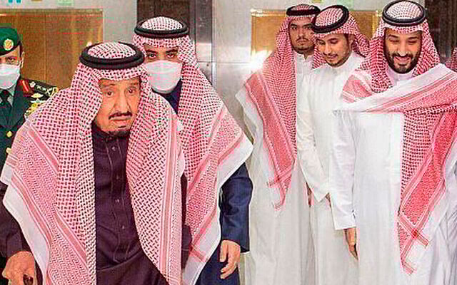 In this photo released by Saudi Press Agency, Saudi King Faisal walks with a cane as he leaves King Faisal Specialist Hospital with Saudi Crown Prince Mohammed bin Salman, right, and entourage, in Riyadh, Saudi Arabia, March, 16, 2022. (Saudi Press Agency via AP) In this photo released by Saudi Press Agency, Saudi King Faisal walks with a cane as he leaves King Faisal Specialist Hospital with Saudi Crown Prince Mohammed bin Salman, right, and entourage, in Riyadh, Saudi Arabia, March, 16, 2022. (Saudi Press Agency via AP)