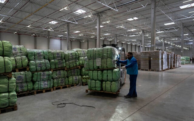 UNHCR staff load a truck with supplies for Ukraine in an aid warehouse at Rzeszow airport, in Rzeszow, southeastern Poland, March 16, 2022. (AP Photo/Petros Giannakouris) UNHCR staff load a truck with supplies for Ukraine in an aid warehouse at Rzeszow airport, in Rzeszow, southeastern Poland, March 16, 2022. (AP Photo/Petros Giannakouris)