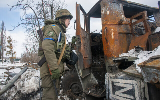 A Ukrainian national guard soldier inspects a damaged Russian military vehicle in Kharkiv, Ukraine, March 16, 2022. (AP Photo/Andrew Marienko) A Ukrainian national guard soldier inspects a damaged Russian military vehicle in Kharkiv, Ukraine, March 16, 2022. (AP Photo/Andrew Marienko)