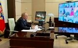 Russian President Vladimir Putin holds a video conference, March 16, 2022, at the Novo-Ogaryovo residence, outside Moscow. (Russian Presidential Press Service via AP)