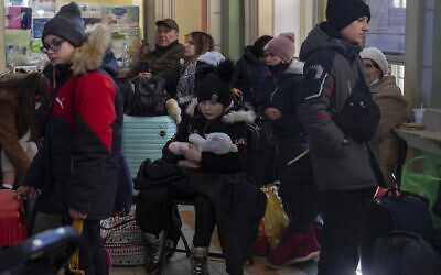 People who fled the war in Ukraine wait at the train station in Przemysl, southeastern Poland, Thursday, March 17, 2022. (AP Photo/Petros Giannakouris) People who fled the war in Ukraine wait at the train station in Przemysl, southeastern Poland, Thursday, March 17, 2022. (AP Photo/Petros Giannakouris)